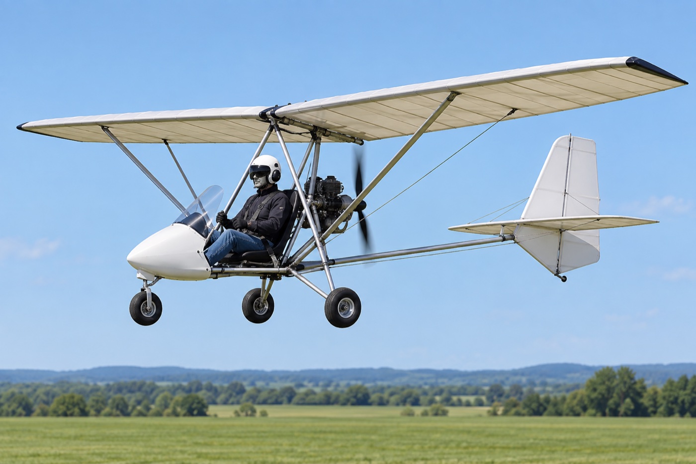 Single-seat fixed-wing ultralight-style vehicle with a rear pusher propeller.